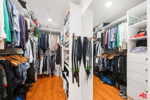 walk in closet featuring light hardwood / wood-style floors