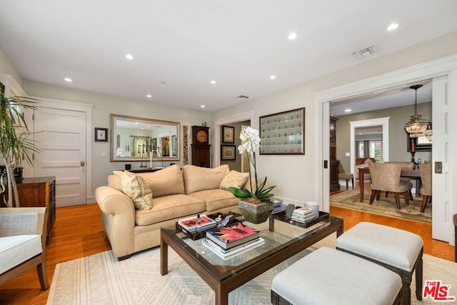 living room with light hardwood / wood-style floors