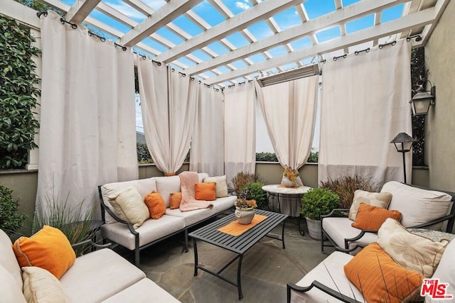 view of patio / terrace with outdoor lounge area and a pergola