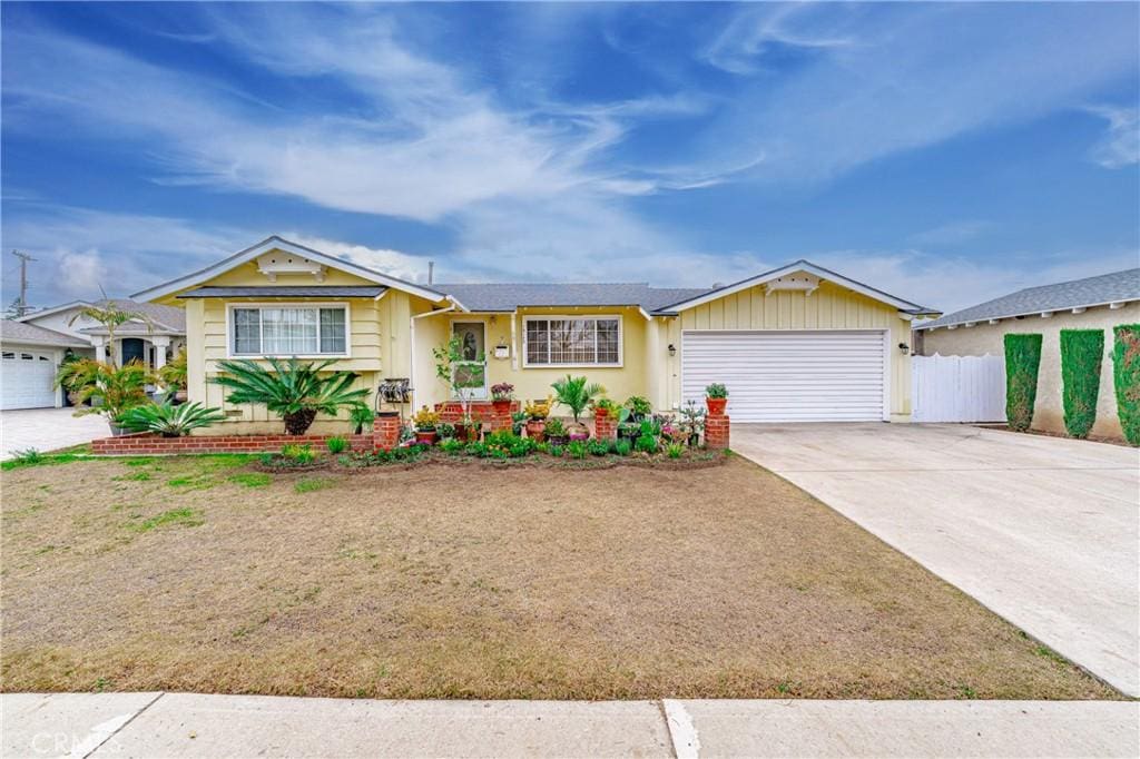 ranch-style home featuring a garage