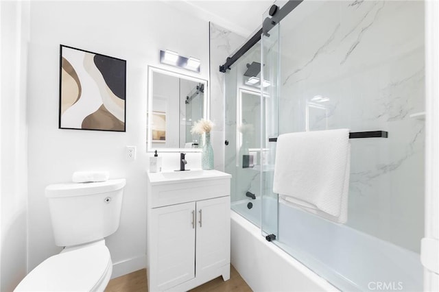 full bathroom with enclosed tub / shower combo, vanity, toilet, and hardwood / wood-style floors