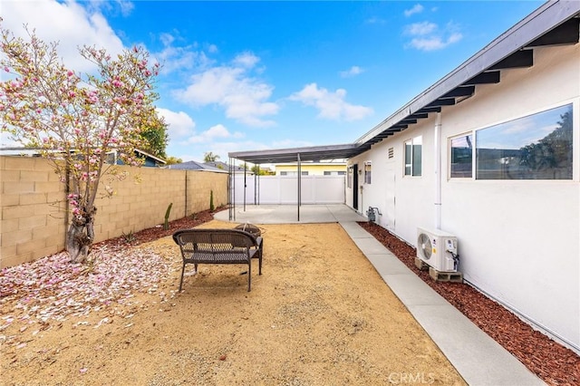 view of yard featuring a patio and ac unit