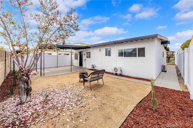 back of property with a patio