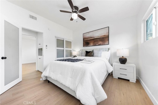 bedroom with ceiling fan and light wood-type flooring