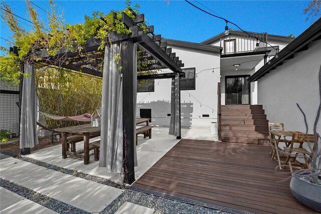 wooden deck featuring a pergola