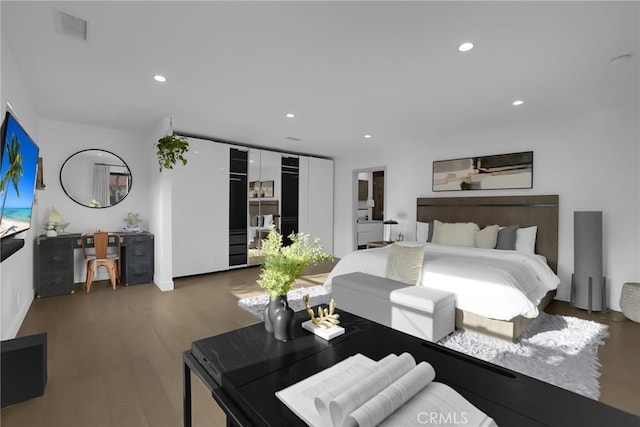 bedroom featuring dark hardwood / wood-style flooring