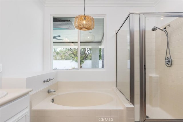 bathroom with vanity, separate shower and tub, and crown molding