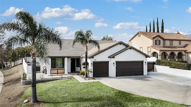 view of front of house with a garage and a front yard