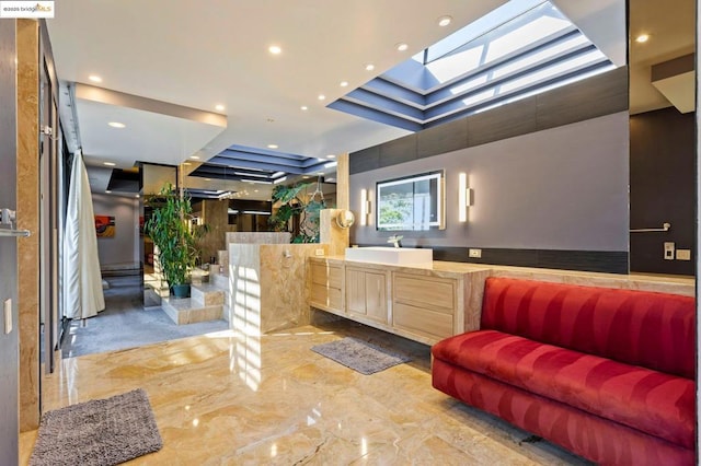 interior space featuring sink and a skylight