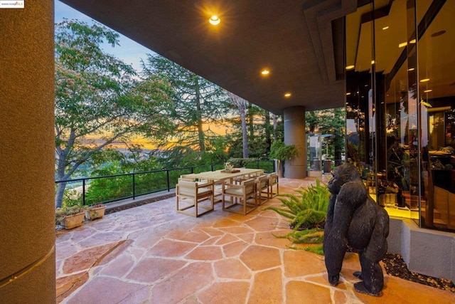 view of patio terrace at dusk