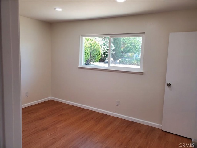 unfurnished room featuring wood-type flooring