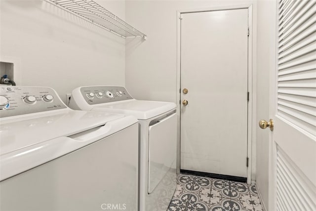 clothes washing area featuring independent washer and dryer