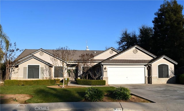 ranch-style house featuring a garage and a front lawn