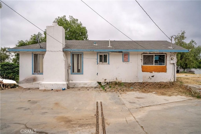 back of property with a patio area