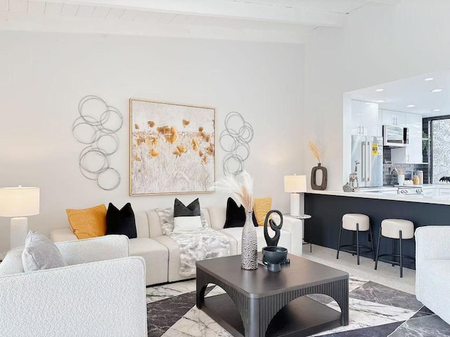 living room featuring beam ceiling