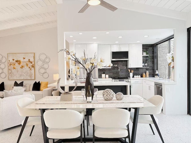 dining room with vaulted ceiling with beams, wooden ceiling, sink, and ceiling fan