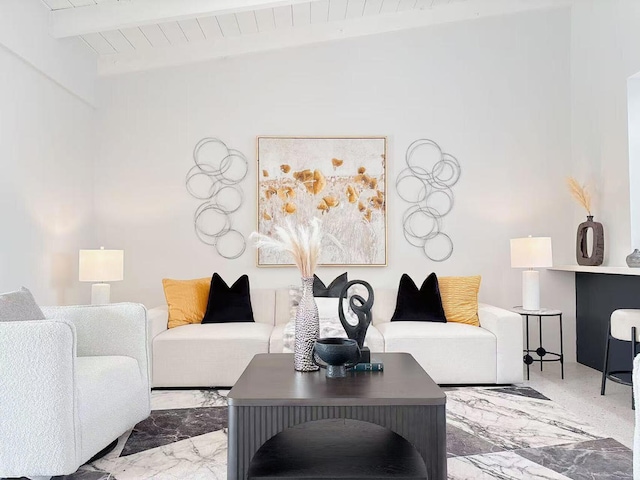 living room featuring beamed ceiling and wooden ceiling