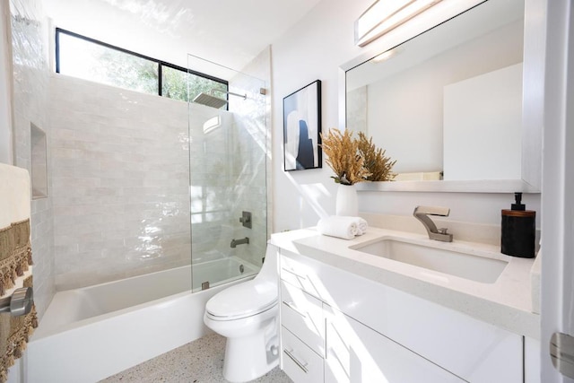 full bathroom with vanity, toilet, and tiled shower / bath combo