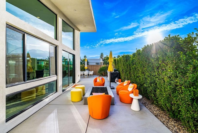 view of patio with a fire pit