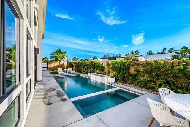 view of swimming pool with a patio