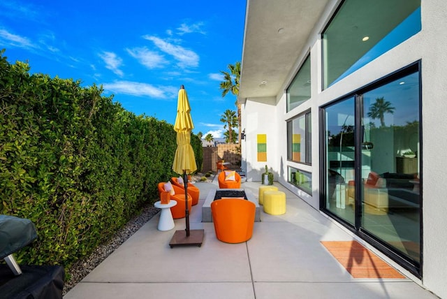 view of patio / terrace with area for grilling and an outdoor fire pit