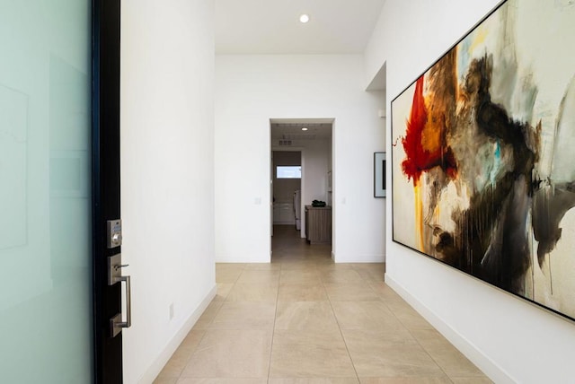 corridor with light tile patterned floors