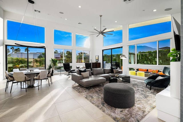 sunroom featuring ceiling fan