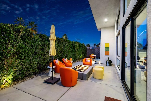 view of patio with a fire pit