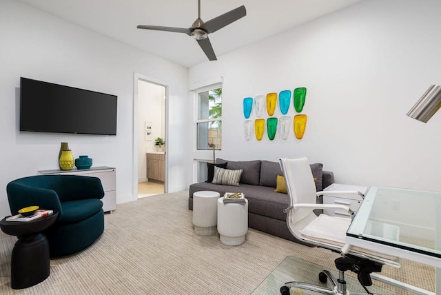 living room featuring light colored carpet and ceiling fan