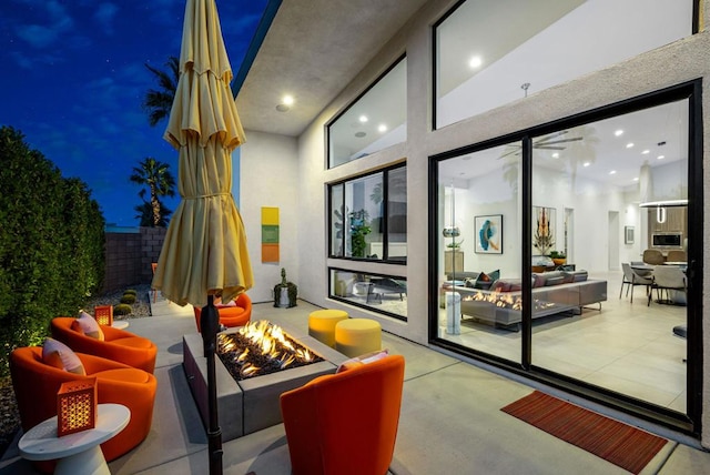 view of patio / terrace with an outdoor fire pit