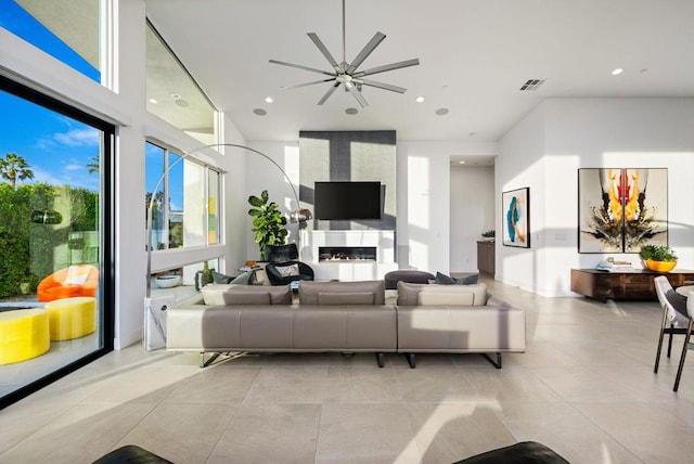 living room featuring a large fireplace