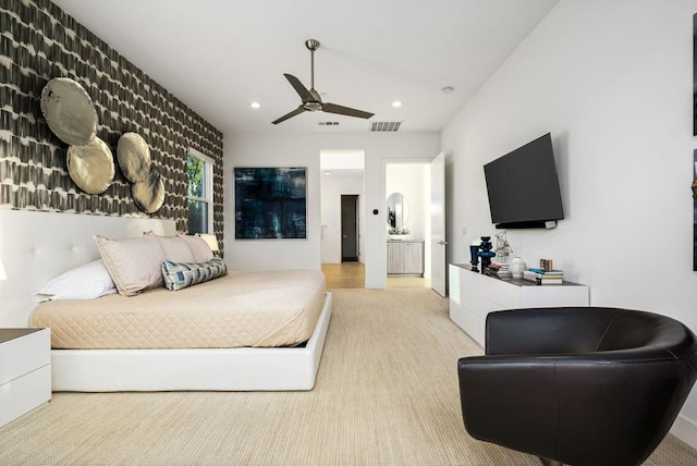 bedroom with ceiling fan and light carpet