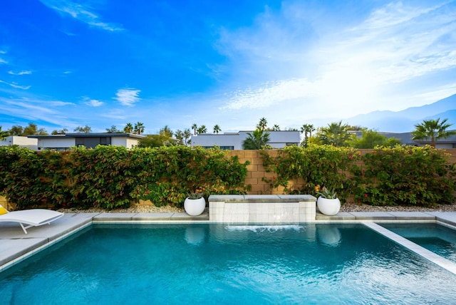 view of pool featuring a mountain view