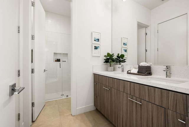 bathroom featuring walk in shower, tile patterned floors, and vanity