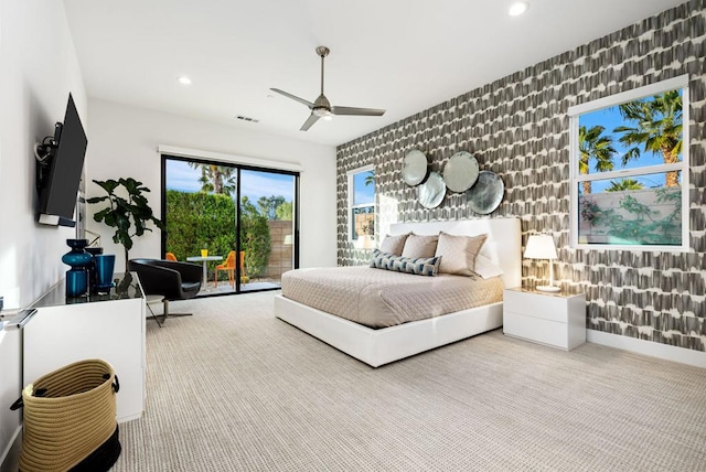 carpeted bedroom featuring access to outside and ceiling fan