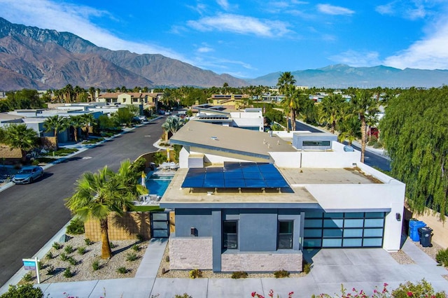 birds eye view of property featuring a mountain view