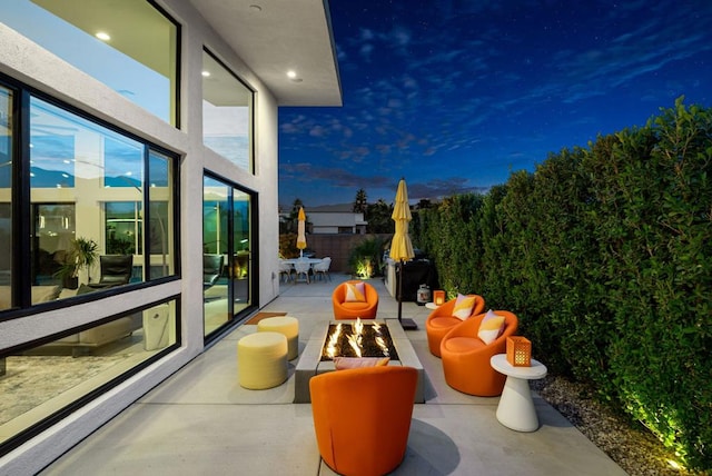 patio terrace at dusk with an outdoor fire pit