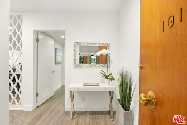 bathroom with hardwood / wood-style flooring