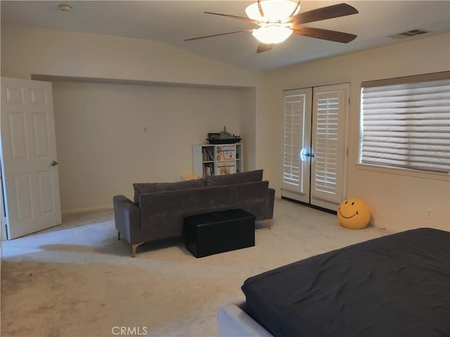 bedroom with vaulted ceiling, access to outside, ceiling fan, light carpet, and french doors