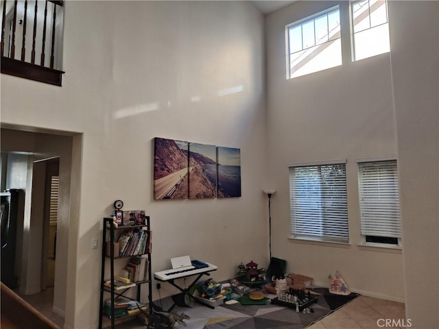 interior space featuring a towering ceiling