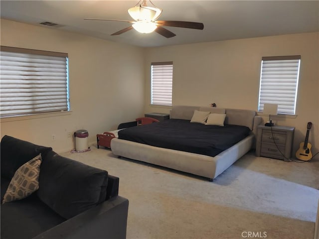 bedroom featuring ceiling fan and carpet floors