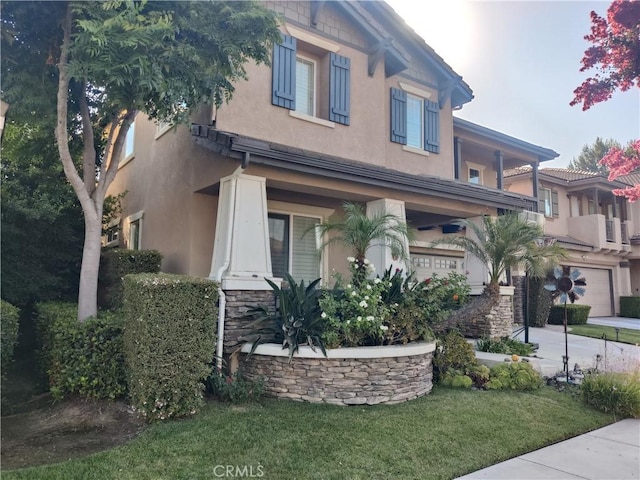 view of front of property with a garage and a front yard