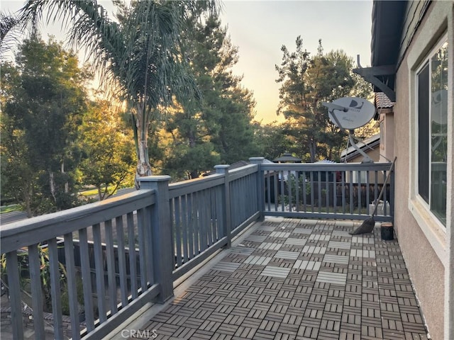 view of balcony at dusk