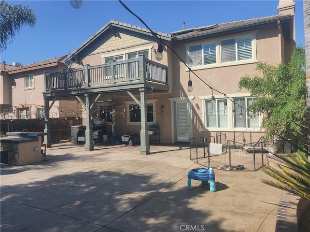 back of property featuring a patio area