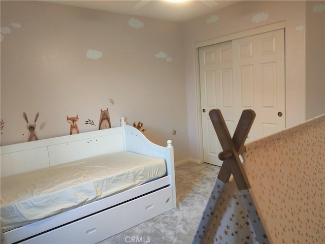 bedroom featuring a closet and carpet