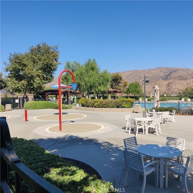 surrounding community featuring a mountain view