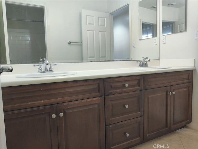 bathroom featuring vanity and tile patterned flooring