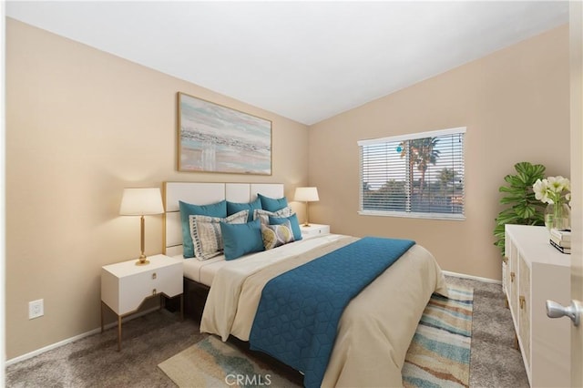 bedroom featuring vaulted ceiling and carpet flooring