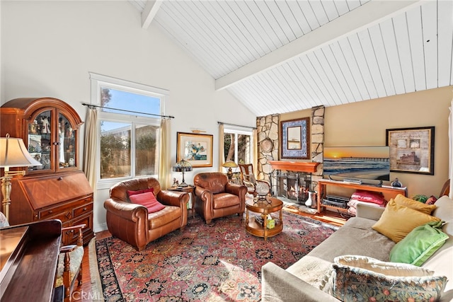 living room with wood-type flooring, high vaulted ceiling, a fireplace, and beam ceiling