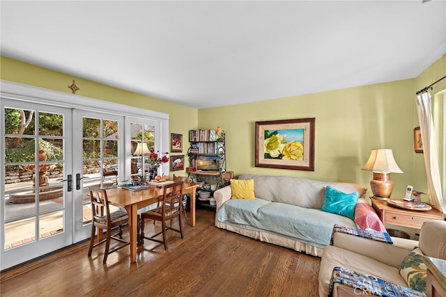 living room featuring french doors and dark hardwood / wood-style flooring